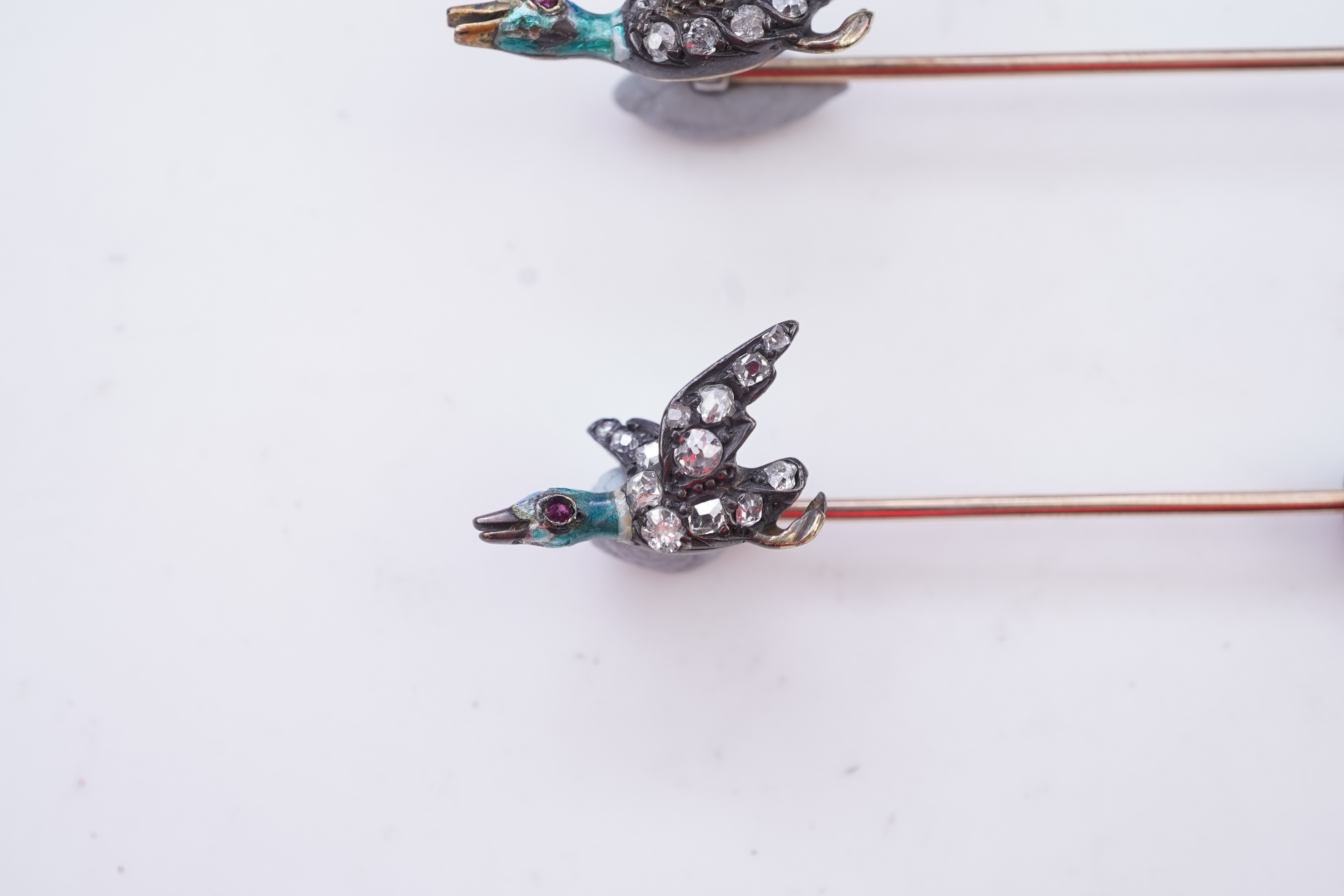 A pair of novelty enamel and diamond stick pins, circa 1900